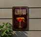 A decorative sign for "Eldorado" cocktail, featuring a glass of the drink with a lemon twist, is displayed on a wall.