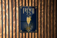 A sign for "French 75" is displayed on a wooden wall.