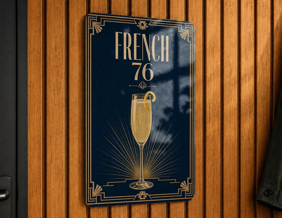 A sign with the text "FRENCH 76" and an illustration of a champagne glass with a lemon slice.
