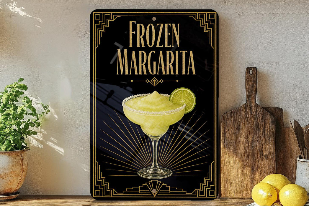A framed poster of a frozen margarita is displayed on a wall, with a wooden cutting board and a potted plant to the side.