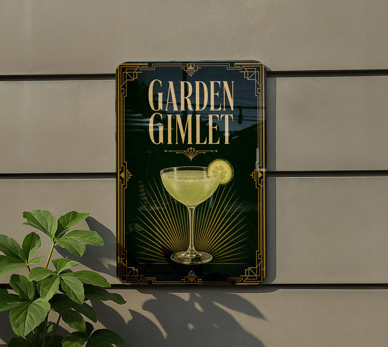 A sign for a cocktail called "Garden Gimlet" is displayed on a wall, featuring a glass of the drink and a slice of lemon.