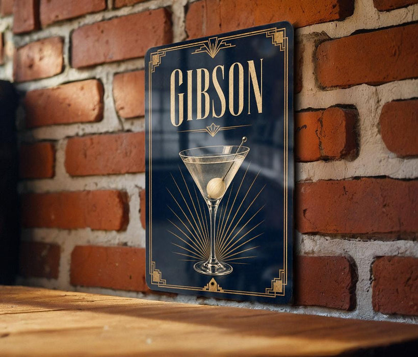 A sign with the name 'GIBSON' displayed prominently, featuring an illustration of a martini glass with a cocktail.