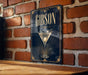 A sign with the name 'GIBSON' displayed prominently, featuring an illustration of a martini glass with a cocktail.