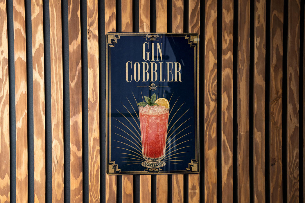 A poster advertising a gin cobler is displayed on a wooden wall.