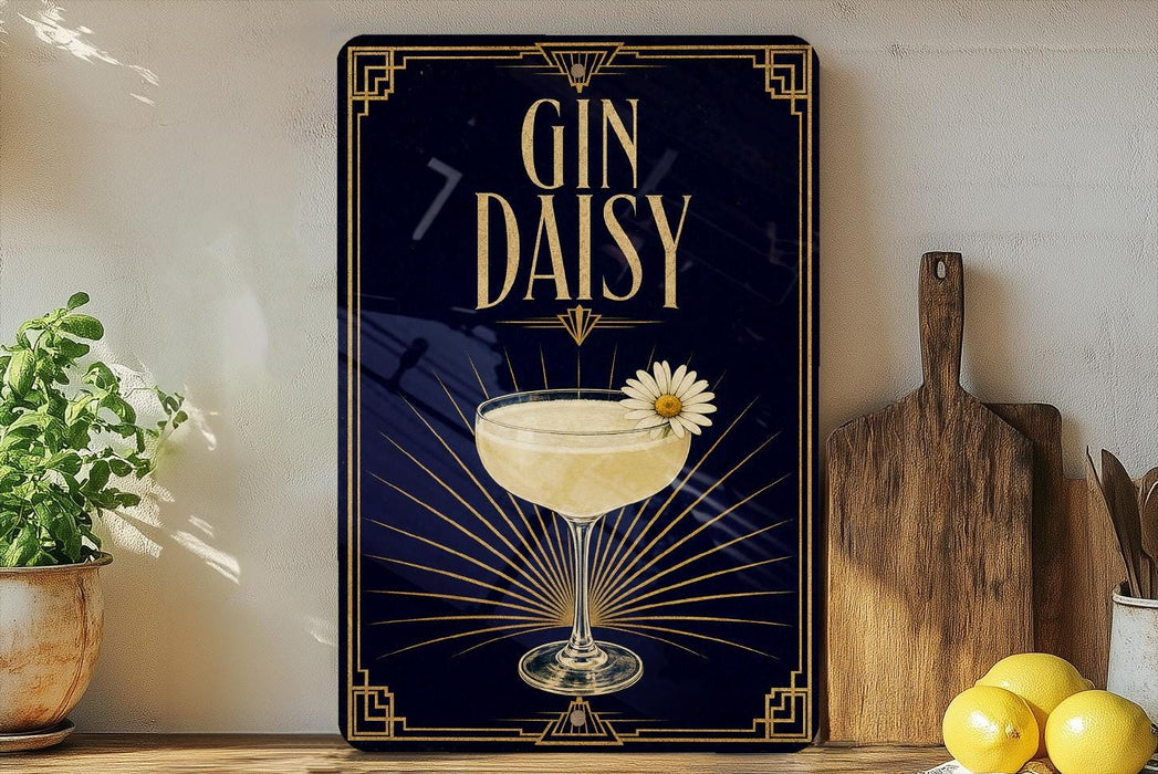 A decorative sign with the text "GIN DAISY" and an illustration of a cocktail glass with a flower on it, placed on a wooden surface next to a cutting board and some lemons.