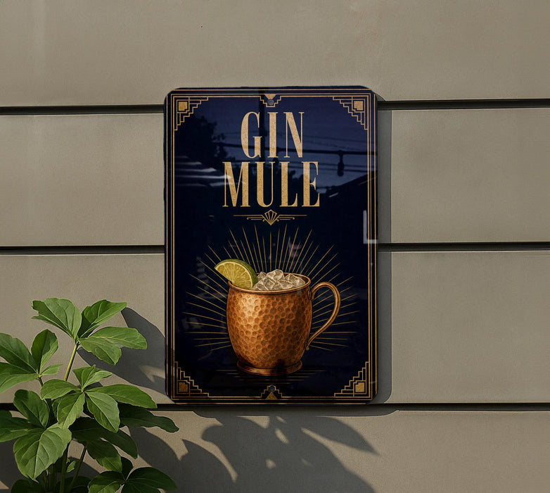 A sign for a gin mule, featuring a copper mug with a lemon slice, is displayed on a wall.