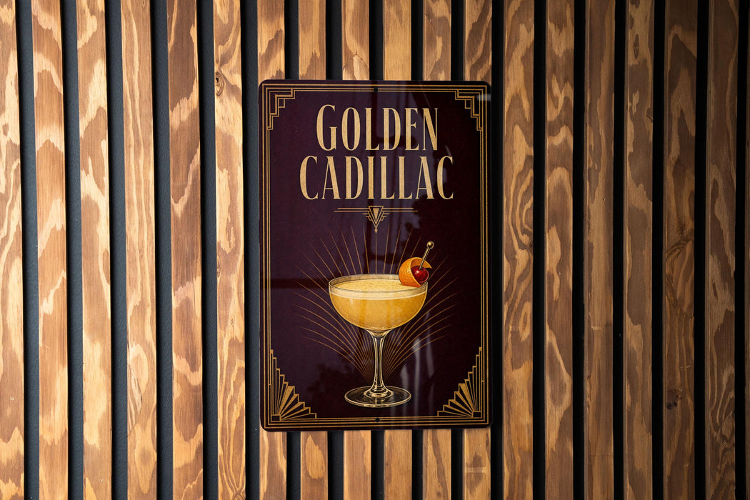 A sign for "Golden Cadillac" cocktail is displayed on a wooden wall.
