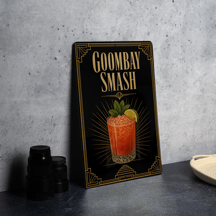 A framed illustration of a Goombay Smash cocktail on a black background, with a decorative border and text.