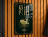 A sign for "Green Point" cocktail, featuring a glass illustration and a garnish.