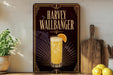 A framed advertisement for a cocktail called "Harvey Wallbanger" featuring a glass of the drink and an orange slice.