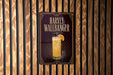 A sign for "Harvey Wallbanger" cocktail, featuring an illustration of a glass with a slice of orange on the front.