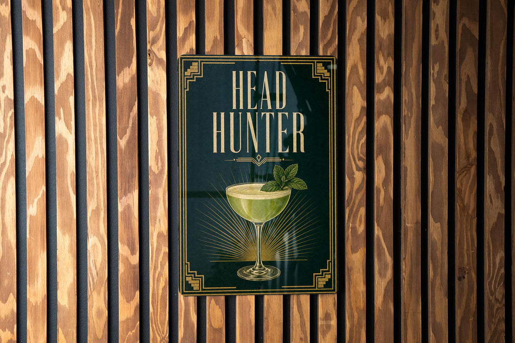 A sign that reads "HEAD HUNTER" is displayed on a wooden wall.