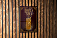 A sign for "Horses Neck" cocktail is displayed on a wooden wall.