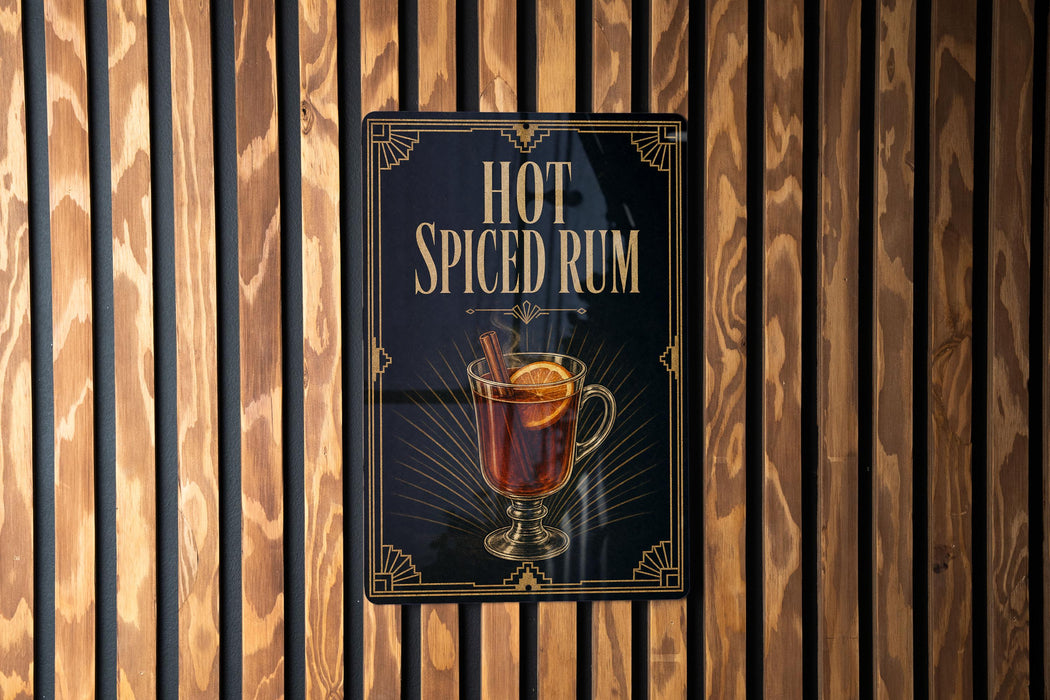 A sign for "Hot Spiced Rum" is displayed on a wooden wall.