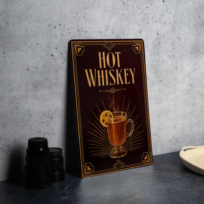 A framed advertisement for "Hot Whiskey" featuring an illustration of a glass of whiskey with a lemon slice.