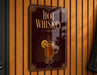 A sign on a wooden wall advertising "Hot Whiskey".