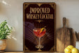 a sign advertising an improved whiskey cocktail, with a glass of the cocktail and a lemon on display.