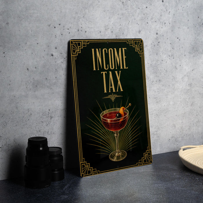 a framed poster with the text "INCOME TAX" and an illustration of a martini glass with an orange slice.