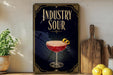 a decorative sign with the text "INDUSTRY SOUR" and an illustration of a cocktail glass with a lemon twist.