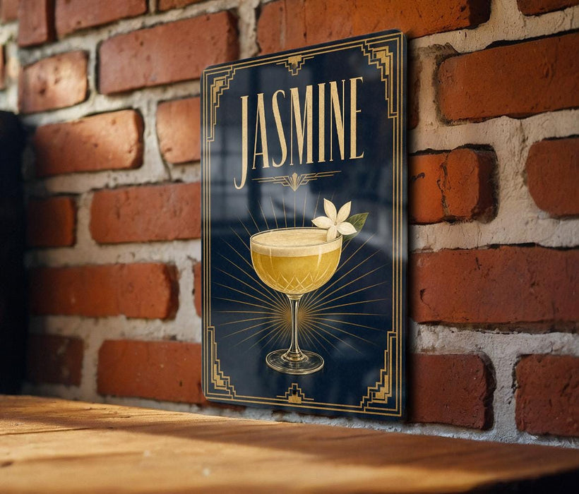 A poster with a glass of jasmine cocktail and a flower on a brick wall.