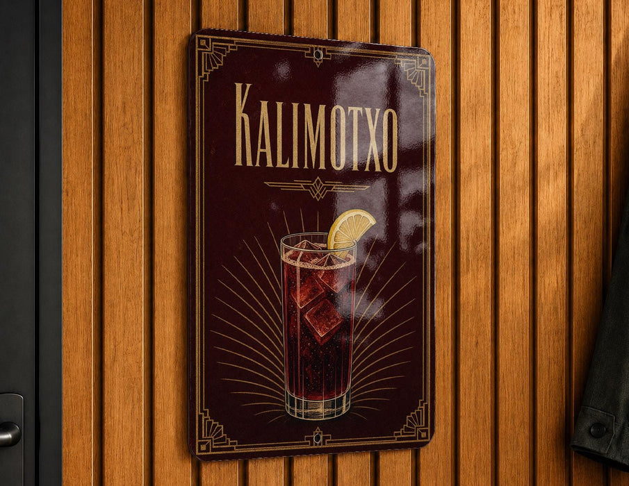 A sign with the text "KALIMOTXO" and an illustration of a cocktail with a lemon slice.