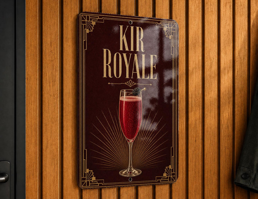 A sign for "Kir Royale" cocktail is displayed on a wooden wall.