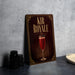a decorative sign with the text "KIR ROYALE" and an illustration of a glass of red wine.