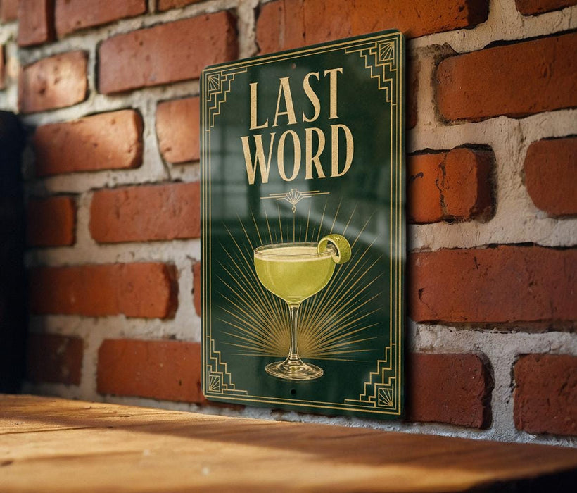 A sign with the text "LAST WORD" and an illustration of a cocktail glass is displayed on a brick wall.