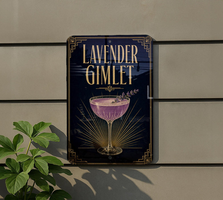 a sign for a lavender gimlet cocktail, which is a purple drink with a garnish, placed on a wall.