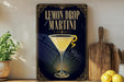 A framed advertisement for a lemon drop martini, featuring a glass of the cocktail with a lemon twist on the rim.