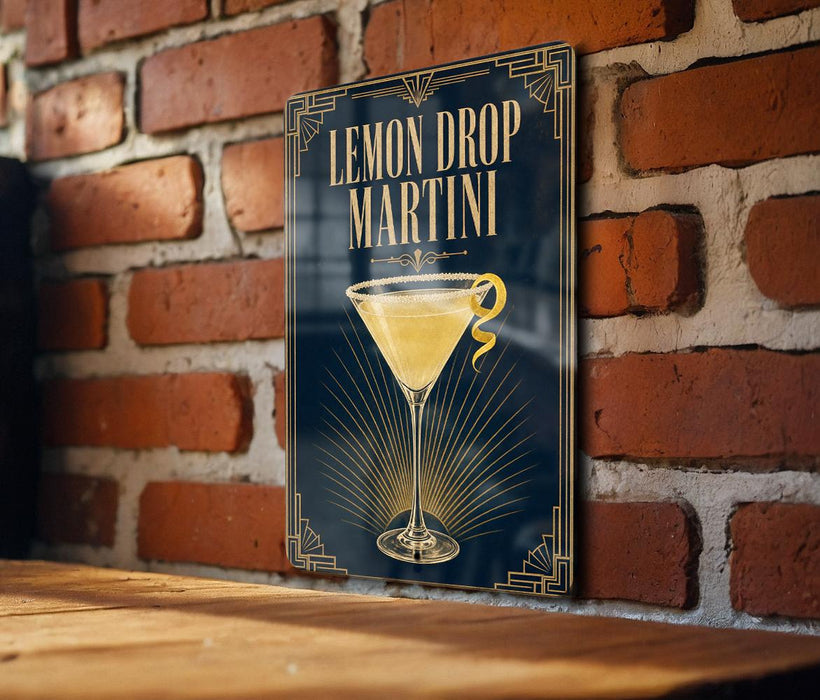 A sign with the text "Lemon Drop Martini" and an illustration of a martini glass with a lemon twist.