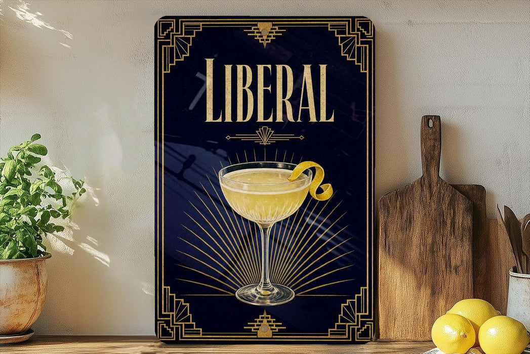 A framed poster with the word "LIBERAL" prominently displayed, featuring an illustration of a cocktail glass with a lemon twist.