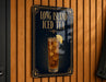 A sign for Long Island Iced Tea, featuring an illustration of a tall glass filled with iced tea and lemon slices.
