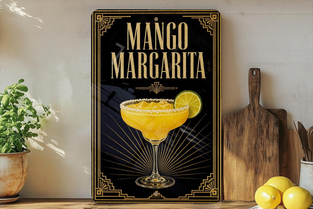 A framed poster of a mango margarita cocktail is displayed on a wall, with a wooden cutting board and a potted plant to the side.