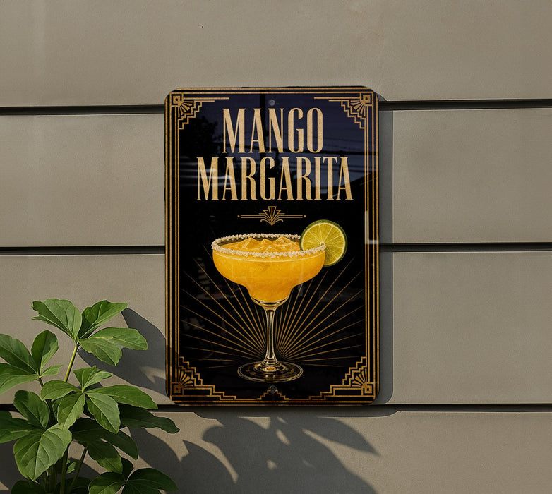 A sign for a mango margarita cocktail is displayed on a wall, featuring an illustration of a margarita glass with a lime slice.
