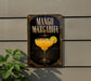 A sign for a mango margarita cocktail is displayed on a wall, featuring an illustration of a margarita glass with a lime slice.