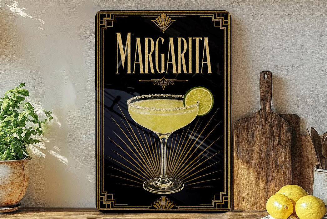 A framed poster of a margarita glass with a lime slice, placed on a shelf next to a wooden cutting board and a potted plant.