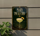 A decorative sign for "Mary Pickford" cocktail, featuring a glass illustration and a decorative border.