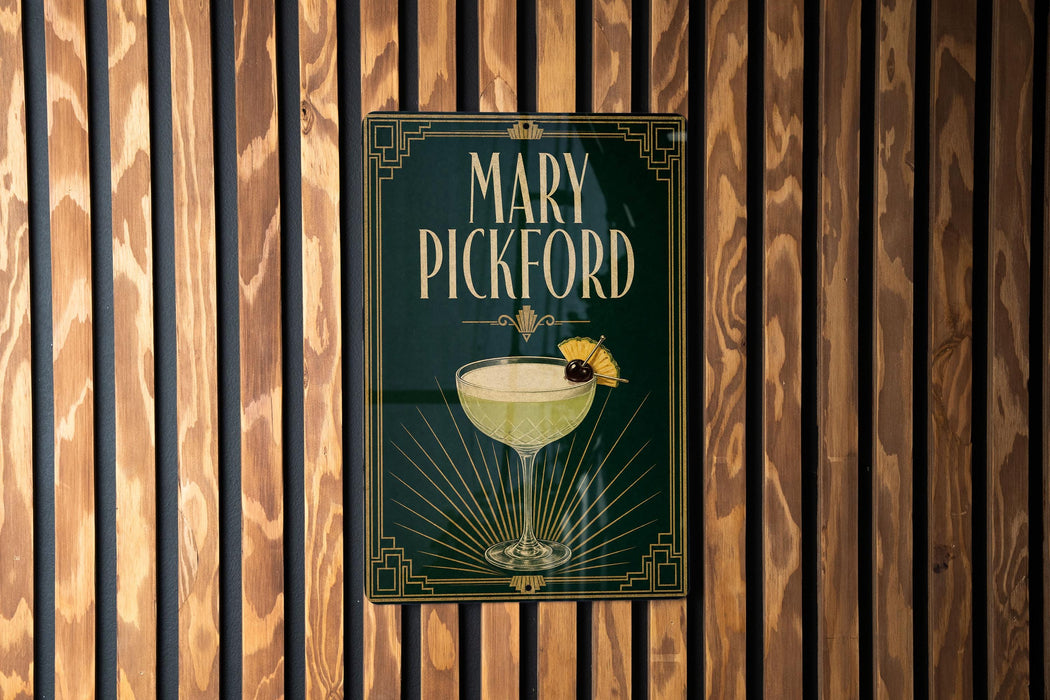 A sign for "Mary Pickford" cocktail is displayed on a wooden wall.