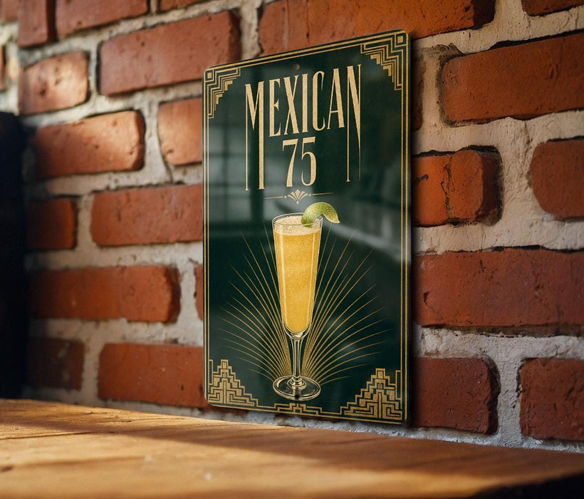 A sign with the text "MEXICAN 75" and an illustration of a glass of Mexican beer or cocktail, placed on a wooden surface against a brick wall.