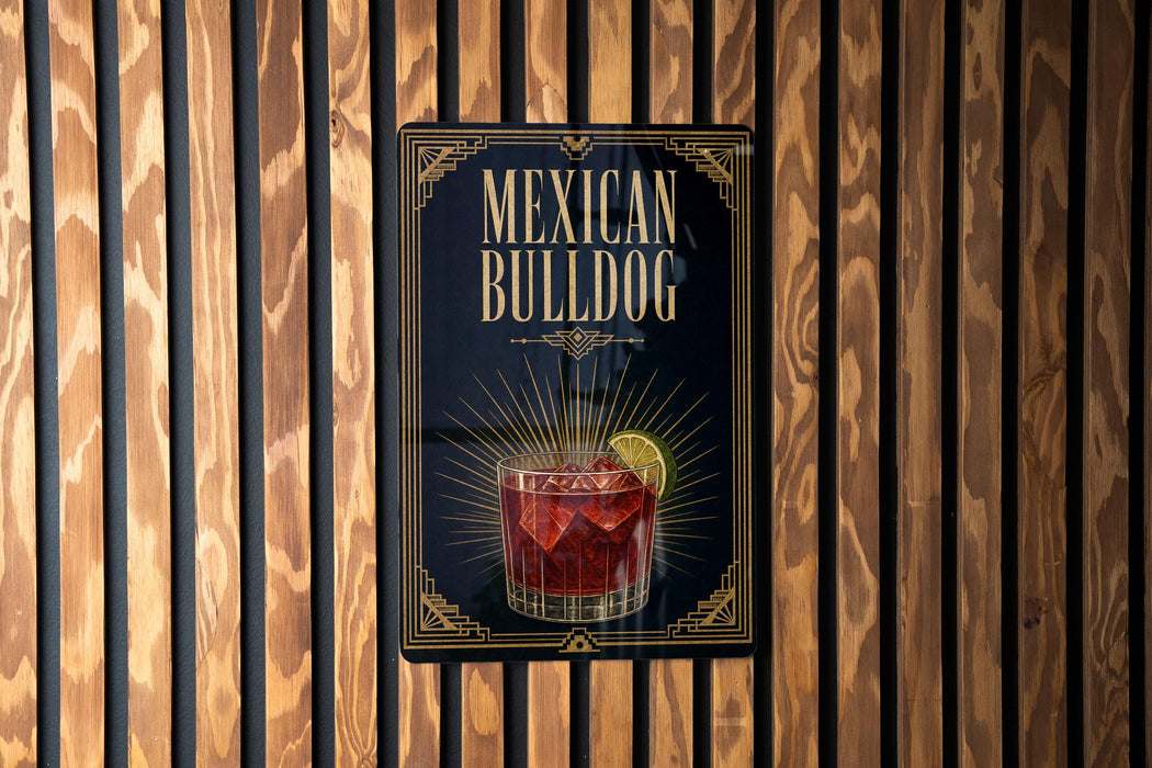 A sign for "Mexican Bulldog" cocktail, featuring an illustration of a glass with a red drink and a lime wedge.