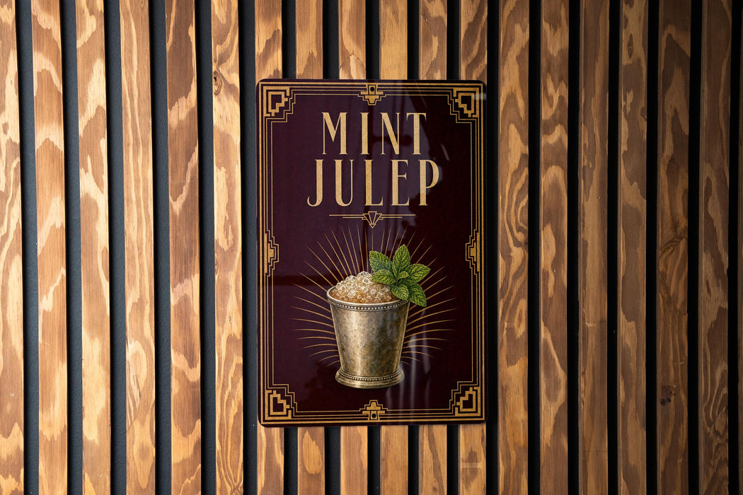 A sign for "MINT JULEP" is displayed on a wooden wall, featuring an illustration of a glass containing a mint-flavored beverage.