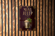 A sign for "MINT JULEP" is displayed on a wooden wall, featuring an illustration of a glass containing a mint-flavored beverage.