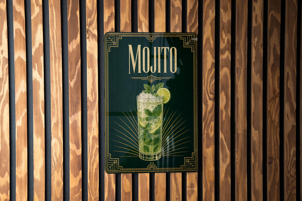 A framed poster of a mojito cocktail is displayed on a wooden wall.