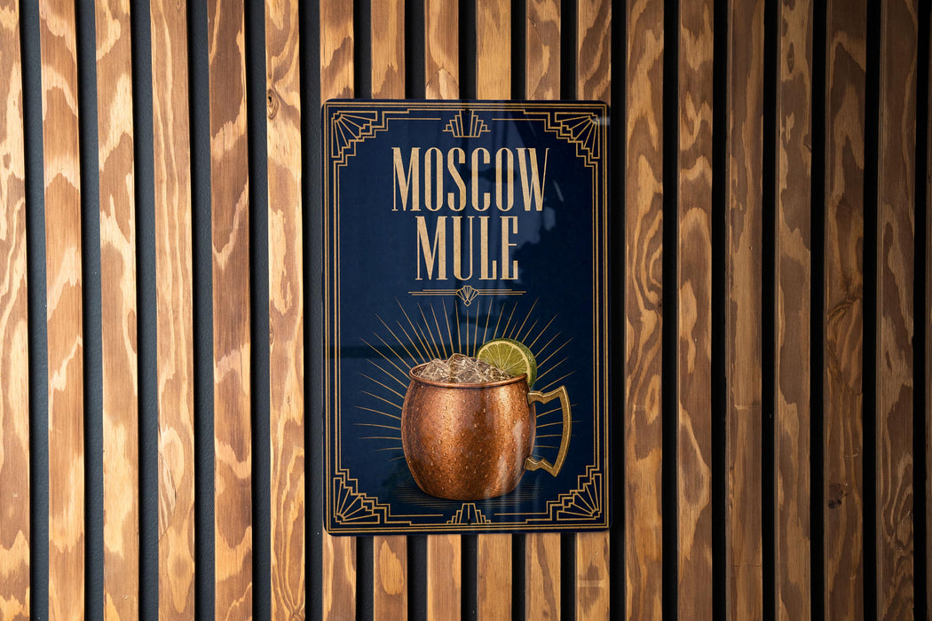 A poster advertising Moscow Mule, a Moscow-style alcoholic cocktail, is displayed on a wooden wall.