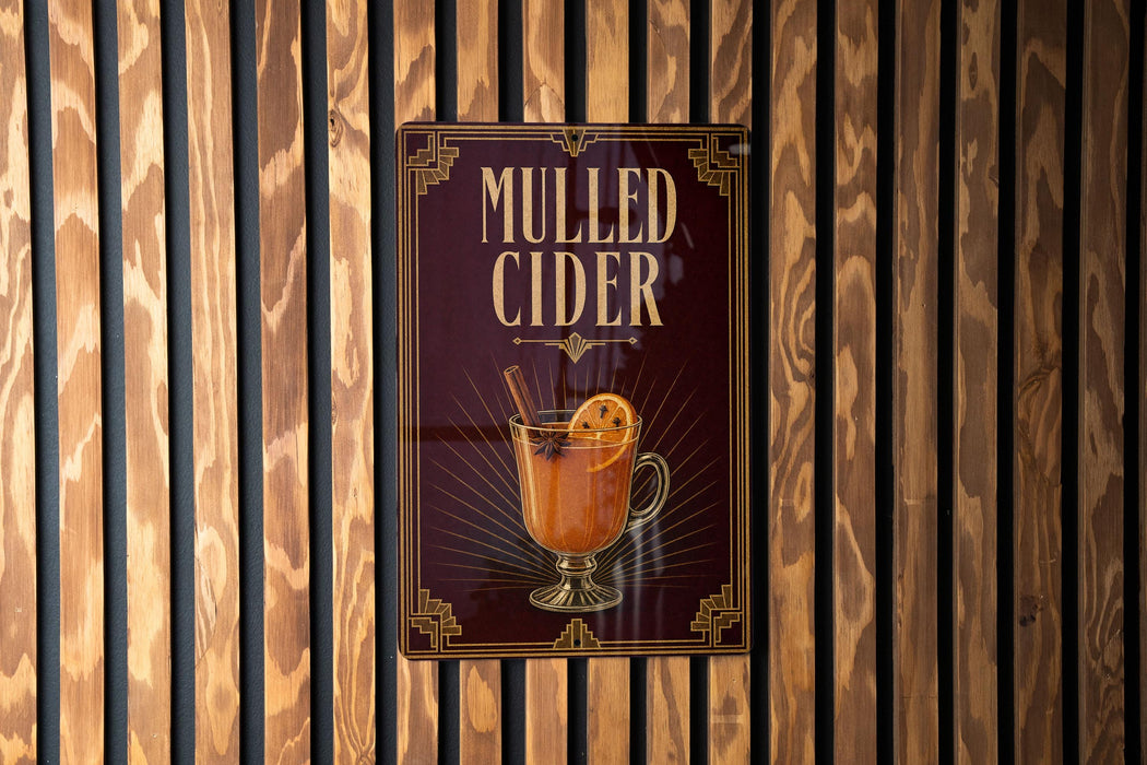 A sign for "Mulled Cider" is displayed on a wooden wall.