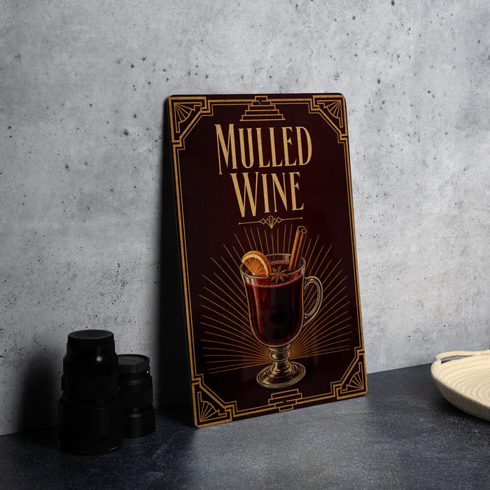 A framed illustration of a mulled wine drink, featuring a glass filled with a dark liquid and garnished with an orange slice and a cinnamon stick.