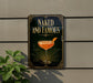 a sign with the text "Naked and Famous" and an illustration of a cocktail glass with a slice of orange.