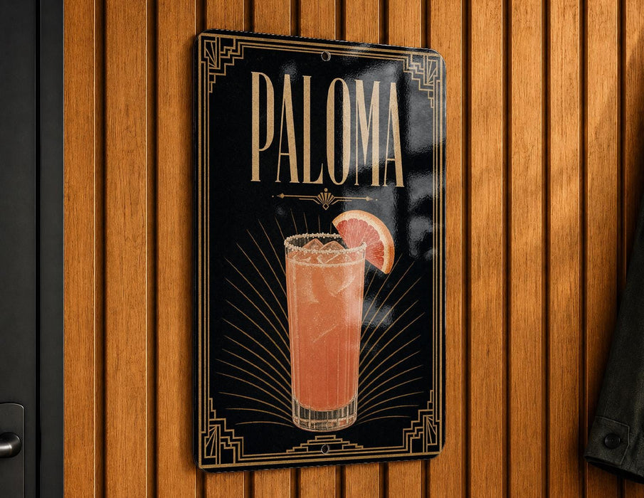 A sign for "Paloma" cocktail hanging on a wooden wall.