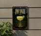 A decorative sign for "PICANTE" cocktail, featuring a stylized illustration of a cocktail glass with a lime wedge.